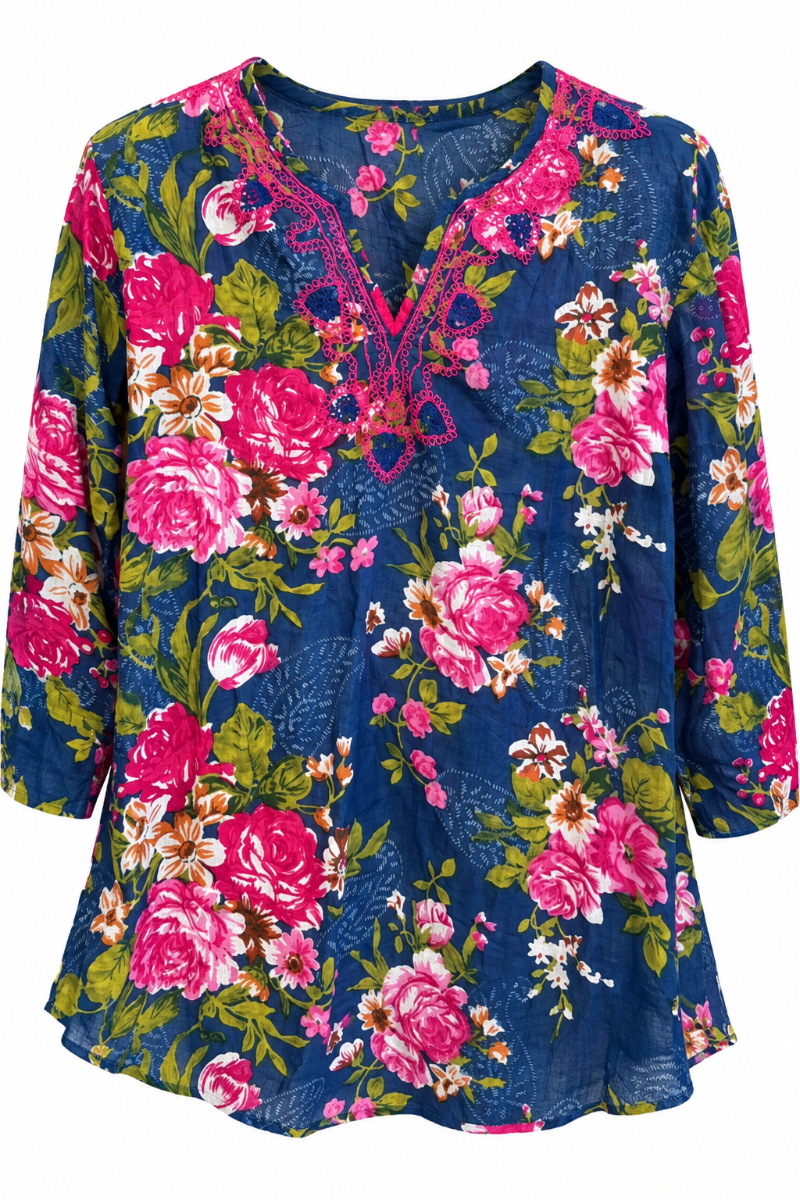 Trestles Clothing Company cotton V-neck blouse featuring a vibrant blue floral print and pink embroidery details.